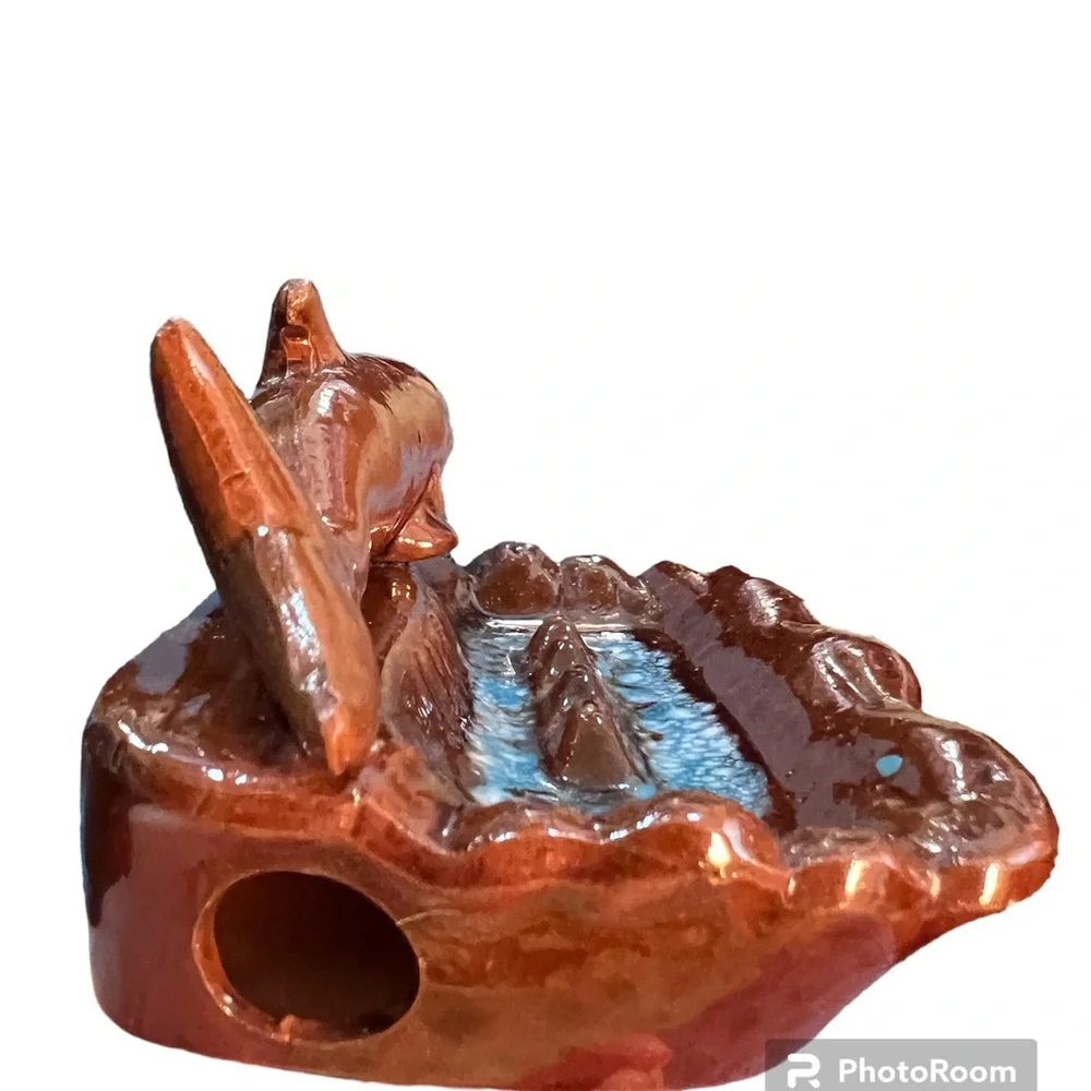 Vintage Ceramic Florida Ashtray with a Brown Dolphin Swimming in Blue Water.